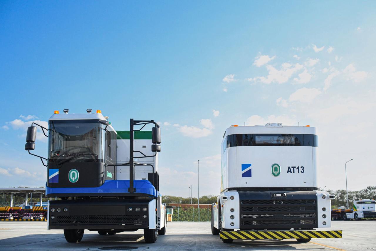 Westwell human-driven terminal tractor and L4 autonomous Q-Truck operating together at Laem Chabang Port, Thailand